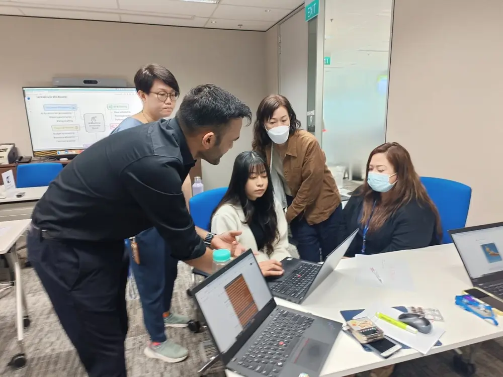 Hands-on help at a table during a session in Singapore